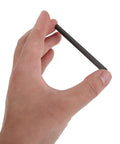Hand holding graphite rod from All In One Electroplating Metal Electrodes Kit With Copper Anode Sheets Zinc Electrodes And Graphite Rod For Chemistry Electrolysis Experiments Stable Conductivity Lab Set For Physics Class And School Science Projects.