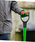 Person holding a shovel with Two Pack D Shaped Shovel Handle Grips Replacement For Garden Tools, Comfortable Non Slip Handles.