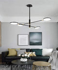 Badass Retro Multi Head Pendant Chandelier With Adjustable Height And Dimmable Control Industrial Vintage Ceiling Light Fixture In Sleek Black E27 Socket Fit For Kitchen Or Dining Room Setup, hanging above a stylish living room.