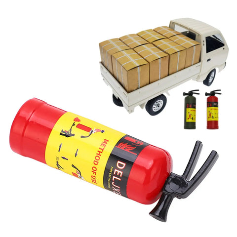 Dope Scale RC Car Fire Extinguisher Prop Lightweight Portable Rescue Gear Realistic Red Decor Solid Build For Axial Scx10 Wpl Mn Rock Crawlers Beast Mode Setup next to truck with boxes.
