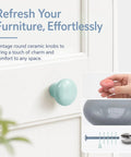 Upgrade Your Cabinets With This Sweet Set Of Sixteen Coral Pink Ceramic Cabinet Knobs Featuring Smooth Round Profiles No Sweat Installation And Top Shelf Hardware, featuring a light blue knob on a drawer.