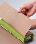 Eight Sheets PTFE Teflon Sheet for Heat Press Transfers shown with green roll, demonstrating nonstick surface and flexibility.