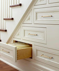 6 Pack 5 Inch Center To Center Knurled Cabinet Pulls In Champagne Bronze with circular end caps on wooden stairway drawers