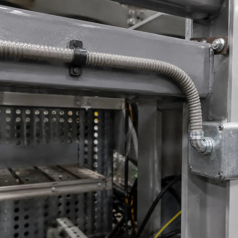 Ironclad Flex Gray Conduit 64mm X 10M Thickened Wire Cable Protector Sleeve in industrial wiring setup.
