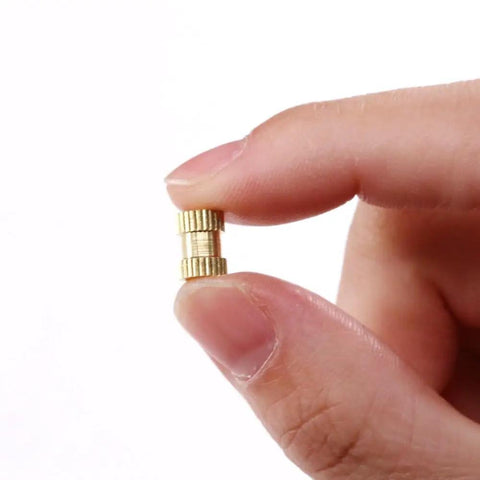 Close-up of brass knurled threaded insert from 250 Piece Brass Knurled Threaded Insert Nuts Kit M2 M3 M4 Female Thread Embedding Assortment