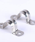 Two stainless steel 1-1/2 inch pipe strap clamps with mounting holes, angled front view