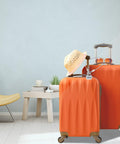 Orange luggage with a hat and sunglasses in a room; suitable for Stainless Steel Wire Cable With Loops for security.