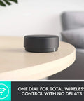 Wireless control dial for Z407 Bluetooth Computer Speakers With Subwoofer And Wireless Control on a desk surface