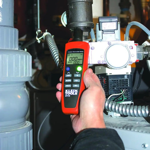 Person using ET110 CO Meter And Carbon Monoxide Tester With Short Term Exposure Limit Alarm in industrial setting