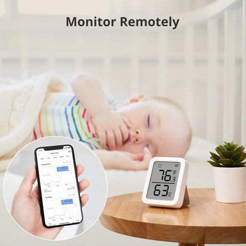 Pan Tilt 2K Indoor Camera With Thermometer Hygrometer And Hub Mini All In One Smart Home Surveillance Kit showing climate data near sleeping baby