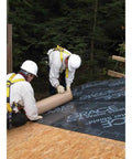 Two workers installing Gotta Have This Top Grade Ice And Water Shield Roofing Underlayment Self Adhered Membrane on a roof.