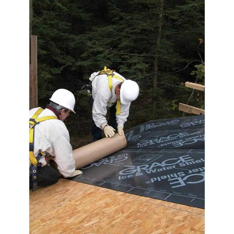 Two workers installing Gotta Have This Top Grade Ice And Water Shield Roofing Underlayment Self Adhered Membrane on a roof.