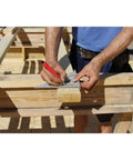 Carpenter using Professional Aluminum Rafter Square 7 Inch With CNC Edges For Dead On Angles on wooden beam