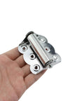 Hand holding 2 Pack Spring Loaded Self-Closing Door Hinges 66mm And 2.6 Inch Stainless Steel Silver Heavy Duty Cabinet Hinge For Doors