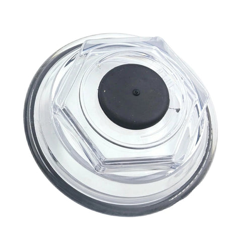 Clear round trailer bearing cap with black center plug; visible inside transparent housing
