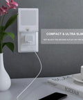 Compact plug in motion sensor night lights with adjustable brightness from 0 to 25 lumens 2700K warm white in living room wall outlet.