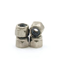 Close-up of stainless steel lock nuts from 24 Piece Fingerboard Lock Nuts Set With Nylon Insert Self Locking for fingerboard trucks.