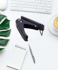 One Quarter Inch Hole Puncher With 20 Sheets Capacity Ergonomic Grip Easy Handheld Metal Paper Punch on desk with office supplies