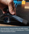 Hand adjusting Beefy T Track Hold Down Clamp Set For Woodworking Two Pack Five And One Half Inch Long By One And One Eighth Inch Wide Blue Black Finish on T-slot table.