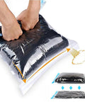 Hands compressing air from 12 Pack Space Saver Vacuum Compression Bags For Travel No Pump Required Transparent PA And PE Material bag