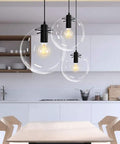 Industrial Clear Glass Globe Pendant Light For Kitchen Loft E27 Socket Adjustable 59In Cord Modern Hanging Ceiling Fixture With 11.8In Globe Diameter UL Listed 1 Bulb Not Included Vintage Yet Contemporary in modern kitchen setting