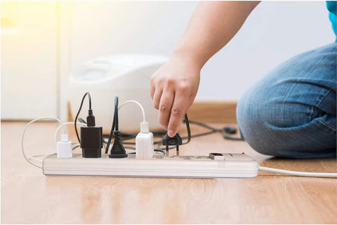 Person using Workhorse Universal Power Strip With Six Outlets And Six Foot Cord 220 240V Surge Protector With Heavy Duty Schuko