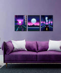 Neon Cyberpunk City Wall Art Set, 3 Panels, 12x16 Inches, Teen Boy Room Decor, Cars Driving Through Neon Suburbs, Retro 80s Inspired Landscape Canvas For Bedroom, Living Room, Or Office displayed above a purple sofa in a modern room.