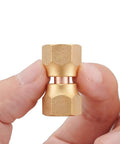 Two Pack Brass 1/4 Inch Female Flare Swivel Adapter Kit For Plumbing, Must Have Swivel Nut Flare Tube Fitting Valve Connector, Durable Solid Brass, Leak Proof, Easy Install, High Pressure Compatible. brass flare adapter held between fingers
