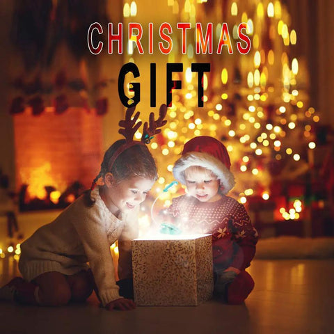 Two children opening a glowing Christmas gift box by a decorated tree, festive background