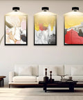 Smooth Dimming Battery Operated Picture Light With Remote Control For Wall Art Posters Frames illuminating three framed artworks.