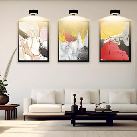 Smooth Dimming Battery Operated Picture Light With Remote Control For Wall Art Posters Frames illuminating three framed artworks.