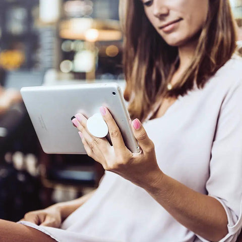 Woman using Introverted But Willing To Discuss Gyrocopters Flying Pilot Swappable PopGrip on tablet for easy viewing
