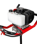 Close-up of gas powered earth auger with 2 stroke engine, part of the heavy duty fence post hole digger for garden and farm.
