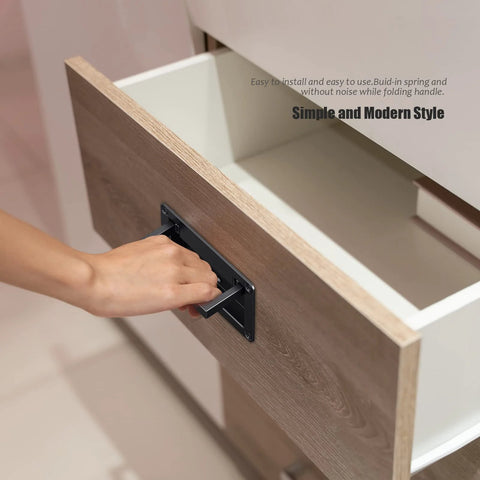 Person using 2 Pack Black Zinc Alloy Recessed Door Pull Handles For Drawers Cabinets Doors And Toolboxes, installed on wooden drawer.