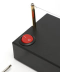 Close-up of Electric Ribbon Cutter And Sealer With Adjustable Heat Range from 100 To 600 Degrees, showing power switch and wire.
