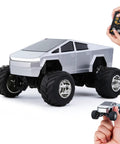 Mini 1:64 Scale Monster RC Truck With Lights, Rechargeable Alloy Shell, silver truck with black tires, remote and hand for scale
