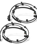 Pair of black ABS wheel speed sensor assemblies with wiring harnesses and connectors.