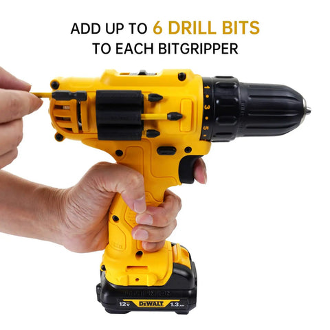 Person inserting drill bit into CNCSS Drill Bit Holder Holster Pack Of 4 Attaches To The Side Of Your Drill Carrying Up To 6 Driver Bits