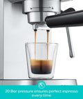 Close-up of Compact 20 Bar Espresso Machine With Steam Milk Frother, showing espresso being brewed into a glass.