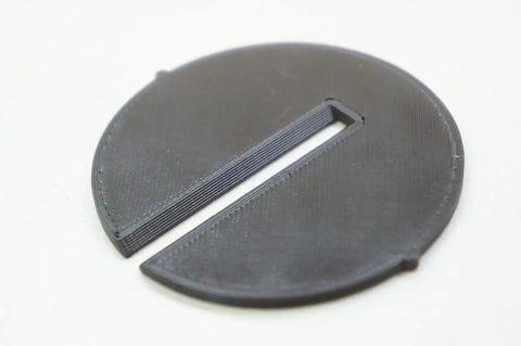 3D Printed Bandsaw Throat Plate Insert for BS220LS 12 Inch Band Saw 2.43 Inch Thick Replacement Part Delivers Secure Fit And Durable Performance For Clean Precise Cuts, showing close-up of black round insert.