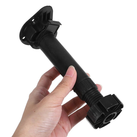 Hand holding a component of the 4 Pack Adjustable Cabinet And Table Furniture Legs Black ABS With Thickened Reinforced Support.