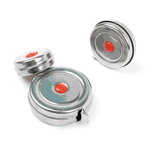 Top Shelf Stainless Steel Tape Measure For Woodworking And Diy Jobs With Dead On One Millimeter Accuracy, three metal reels visible.