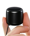Ultra Tiny Bluetooth Speaker With HD Sound And Deep Bass Mini Wireless Speaker for Phone PC and Tablet in hand, palm-sized design