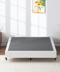 Heavy Duty Queen Box Spring 7 Inch Metal Frame Mattress Foundation Bed Base Built Tough For Rock Solid Support And Zero Flex Design 3000 Pound Weight Limit in a bright bedroom setting.