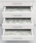 Open drawers lined with Fable Leaf Peel And Stick Wallpaper In White And Off White Floral Peelable Wall Covering That Sticks Smooth