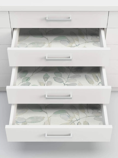Open drawers lined with Fable Leaf Peel And Stick Wallpaper In White And Off White Floral Peelable Wall Covering That Sticks Smooth