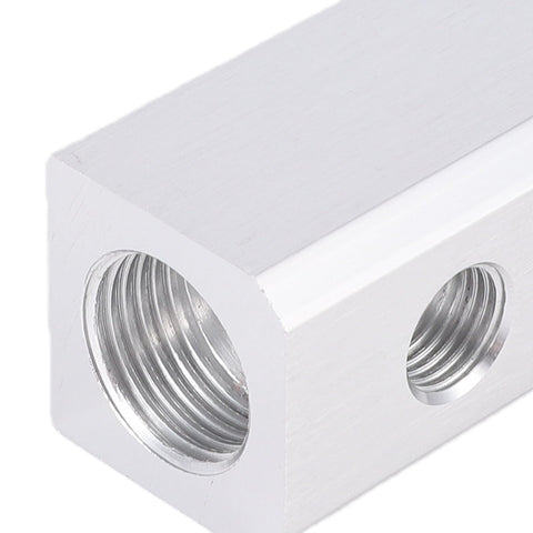 Close-up of Three Way Aluminum Air Manifold With Five Ports, One Quarter Inch NPT Output And Half Inch NPT Supply Port