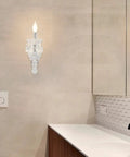 1 Light Distressed White Crystal Wall Sconce With Candle Style Vintage Farmhouse Vibe, French Country Crystal Drops, Elegant Bedroom Bathroom Hallway Living Room Light Fixture in a modern bathroom setting.