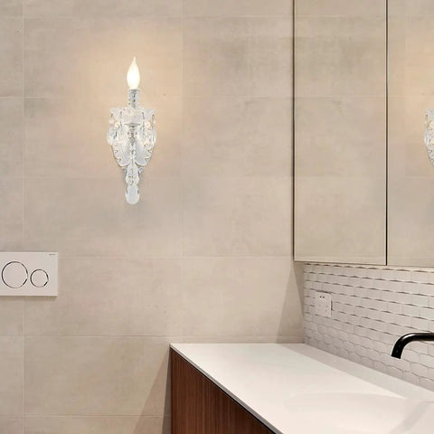 1 Light Distressed White Crystal Wall Sconce With Candle Style Vintage Farmhouse Vibe, French Country Crystal Drops, Elegant Bedroom Bathroom Hallway Living Room Light Fixture in a modern bathroom setting.