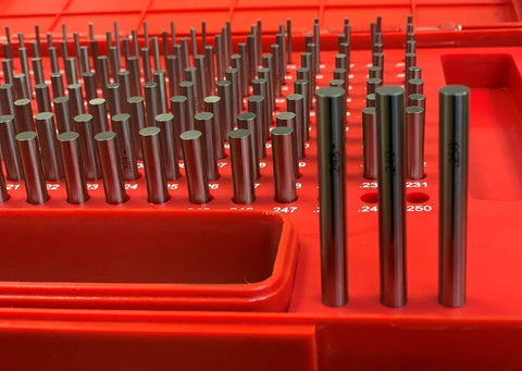 Pin Gauge Set 0.061 To 0.250 Inches, 190 Piece, No Certificate, Pro Grade Build, Fully Hardened 60-62 Rc, Class ZZ Finish, Stacked In A Heavy Duty, Dust Proof Plastic Case With Size Markings For Fast ID And Real Deal Machining Precision. Red case with steel pin gauges